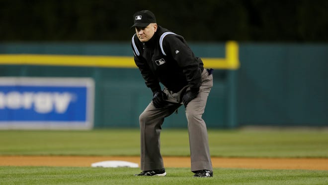Umpire Jeff Nelson is seen at second base during the eighth inning of a baseball game between the Detroit Tigers and the Houston Astros in Detroit.