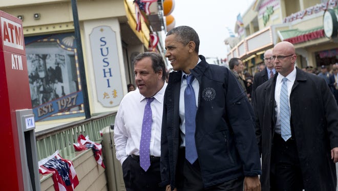 President Obama and New Jersey Gov. Chris Christie tour the boardwalk.