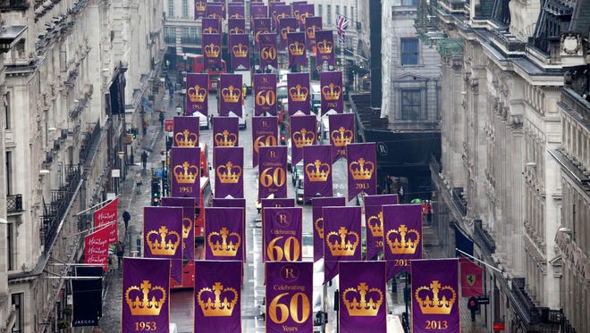 Banners marking 60th anniversary of Queen Elizabeth II's coronation brighten London's Regent Street.