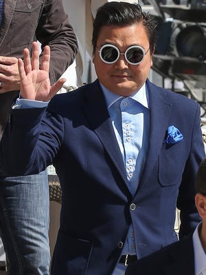 Psy imposter Denis Carre arrives at the  'Martinez' beach during the 66th Annual Cannes Film Festival on May 20.