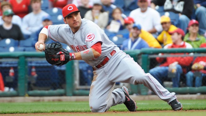 Leading the majors in runs scored and on-base percentage, Reds first baseman Joey Votto is also a major asset on defense.