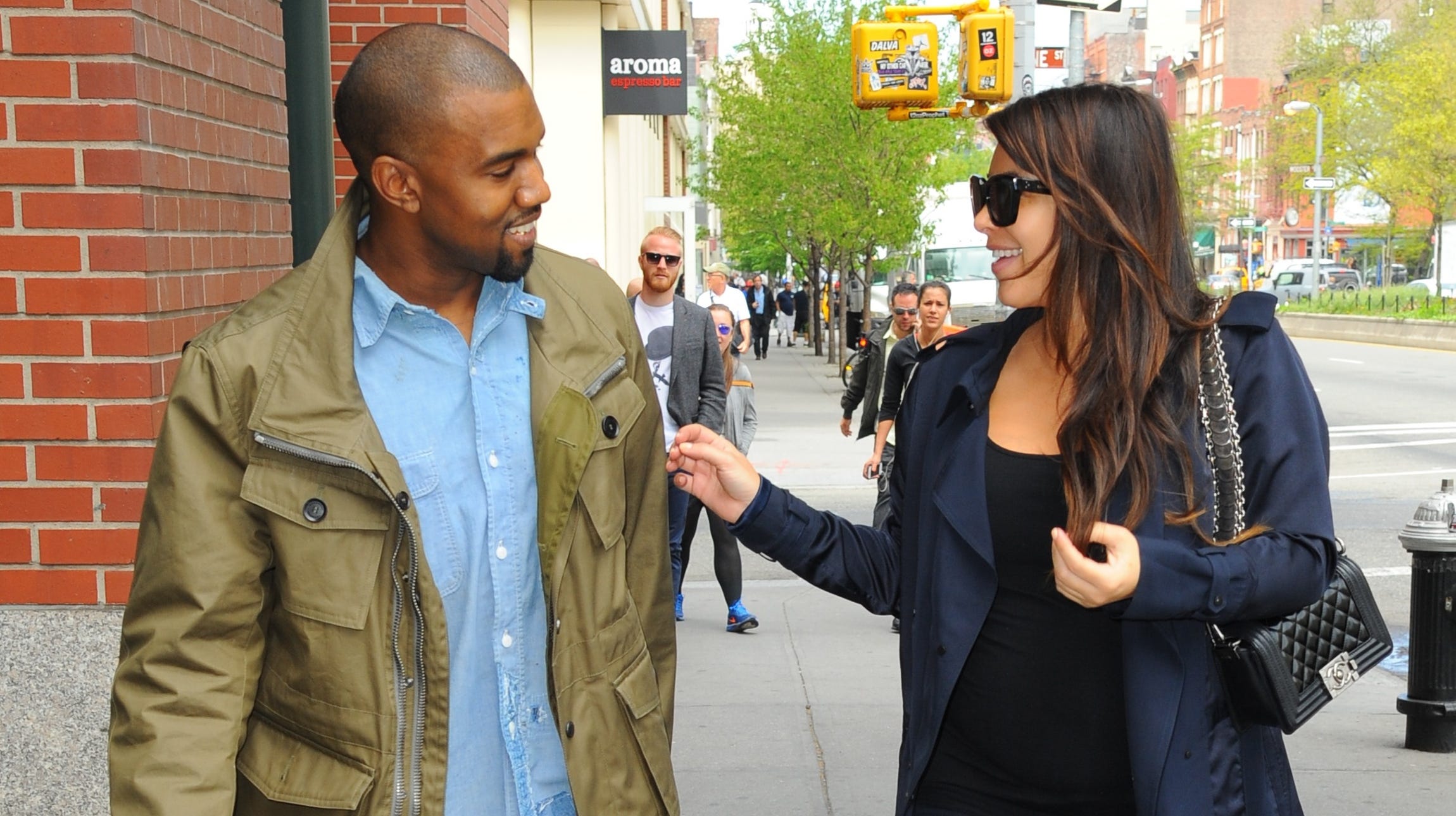 Kim Kardashian and Kanye West are seen in Soho on May 6, 2013, in New York City. It's the rare photo of West smiling in public.