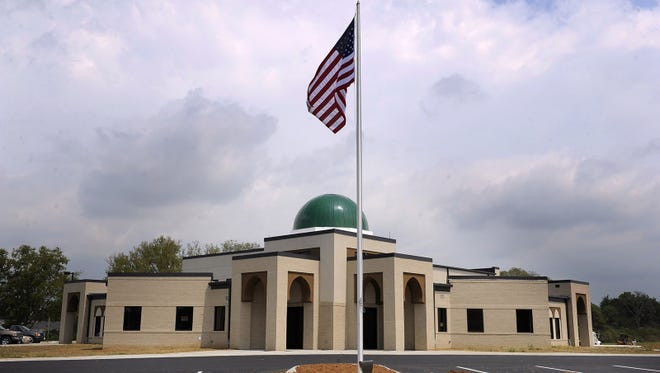 An American flag welcomes worshippers to the Islamic Center of Murfreesboro mosque on Friday, Aug. 10, 2012. Mosque members fought for two years in court battles to have the right to build and occupy the facility.
