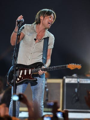 Keith Urban performs during the 2013 CMT Music Awards.