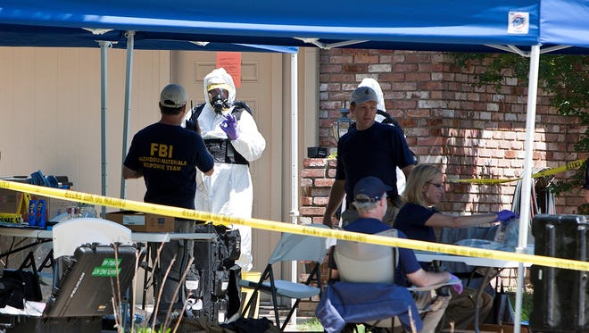 Federal agents search a Boston, Texas, home on Wednesday that was linked to the investigation into ricin-tainted letters sent to New York City's mayor and President Obama.