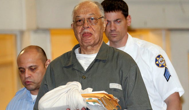 Kermit Gosnell is escorted to a police van on May 13 after being convicted of first-degree murder in the deaths of three babies who were delivered alive and then killed at his clinic.