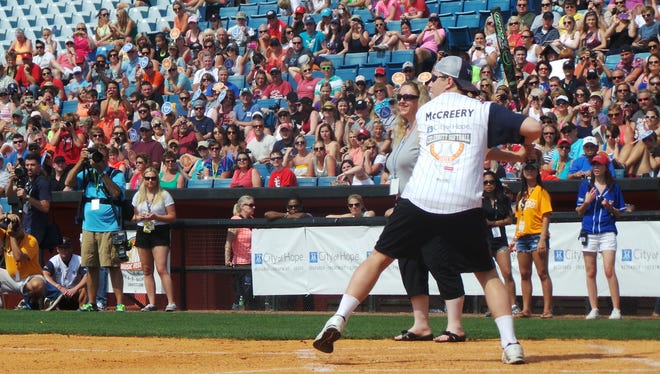 Scotty McCreery gets ready to take a swing during the City of Hope Celebrity Softball Challenge Saturday in Nashville.