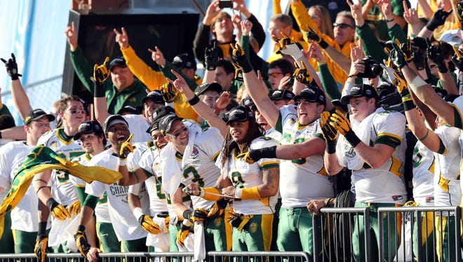 The North Dakota State Bison celebrate after defeating the Sam Houston State Bearkats in the FCS Championship football game at FC Dallas Stadium.