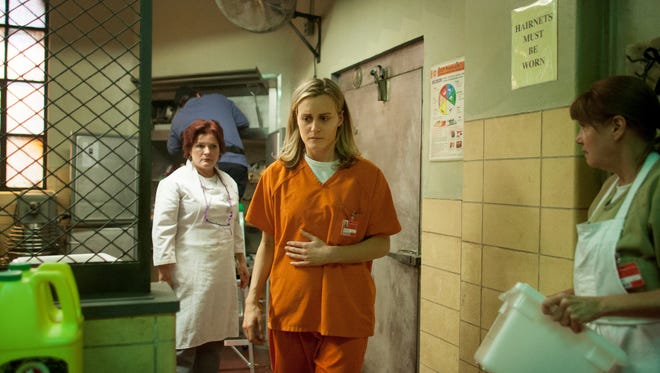 Former 'Star Trek: Voyager' captain Kate Mulgrew, left, is barely recognizable as scene-stealing prison kitchen matron Red, one of the many inmates Piper (Taylor Schilling) offends her first few days in the joint.