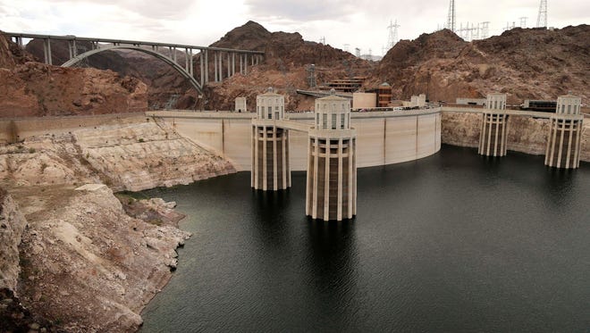 The high water mark for Lake Mead is seen on Hoover Dam and its spillway, Tuesday, April 16, 2013, near Boulder City, Nev. In Sept. 2010, the lake's water levels reached a 54-year low, prompting the Bureau of Reclamation to reduce Hoover Dam's generating capacity by 23%.