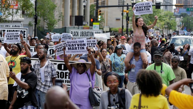 A crowd marches Sunday along Broad Street in Newark to protest George Zimmerman’s acquittal.
