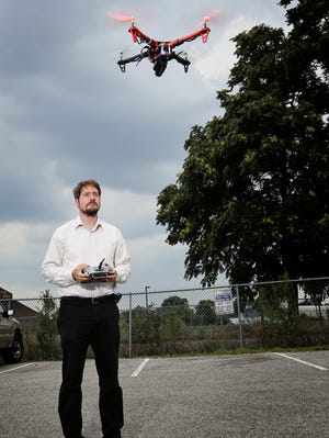 Professor Adrian Lauf flew his drone July 17, 2013, at the University of Louisville Speed School of Engineering.