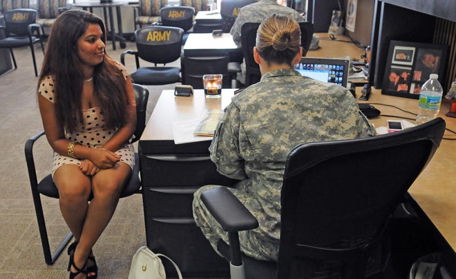 At the Army recruiting station in Rockledge, Fla., recruit Shafag Maria Yuhanna meets with Staff Sgt. Amanda Torres.