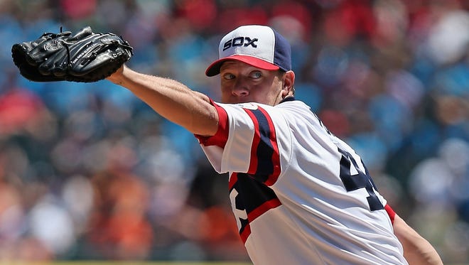 Jake Peavy pitched into the eighth inning to beat the Tigers.