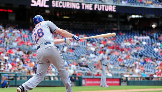 Daniel Murphy, seen here hitting a single,  homered twice and drove in a career-high five runs.