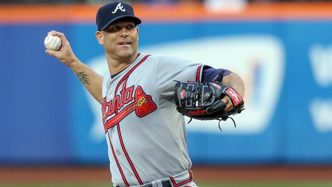 Atlanta Braves starting pitcher Tim Hudson pitches during the first inning against the New York Mets at Citi Field.
