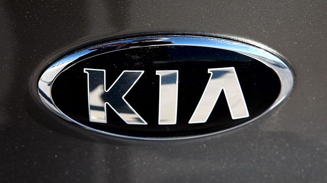 Kia makes over Optima sedan, Forte Koup