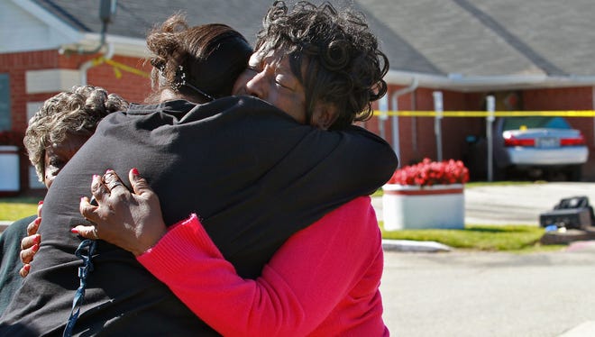 People comfort one another outside of the Greater Sweethome Missionary Baptist Church in Forest Hill, Texas (AP Photo/Fort Worth Star-Telegram, Pauly Moseley) MAGS OUT (FORT WORTH WEEKLY, 360 WEST); INTERNET OUT