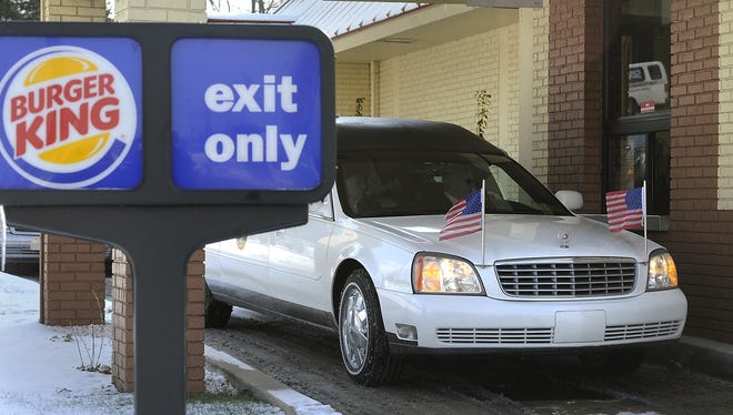 The hearse carrying David Kime, Jr. pulls up to the drive-through at the Burger King in York, Pa. on Saturday.  (AP Photo/York Daily Record, Jason Plotkin)  YORK DISPATCH OUT
