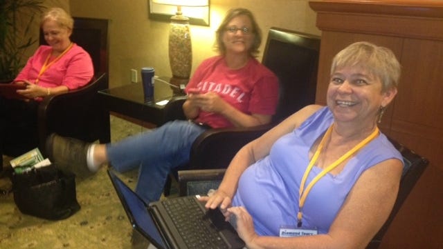 South Carolina residents  Susan Yarbourgh (left), Mona Dukes and Joye Hanna  wait out Hurricane Sandy in a Crowne Plaza hotel near Dulles Airport outside Washington, D.C., on Monday. The return motorcoach trip  was delayed because of the storm. 