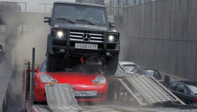 A Mercedes-Benz G Class rolls over a Porsche in the new "Die Hard" movie