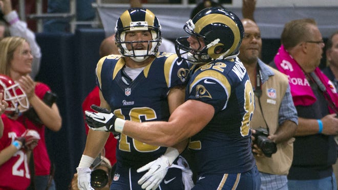 Rams WR Danny Amendola (16) gets congratulated after catching a TD pass off a fake field goal Sunday.