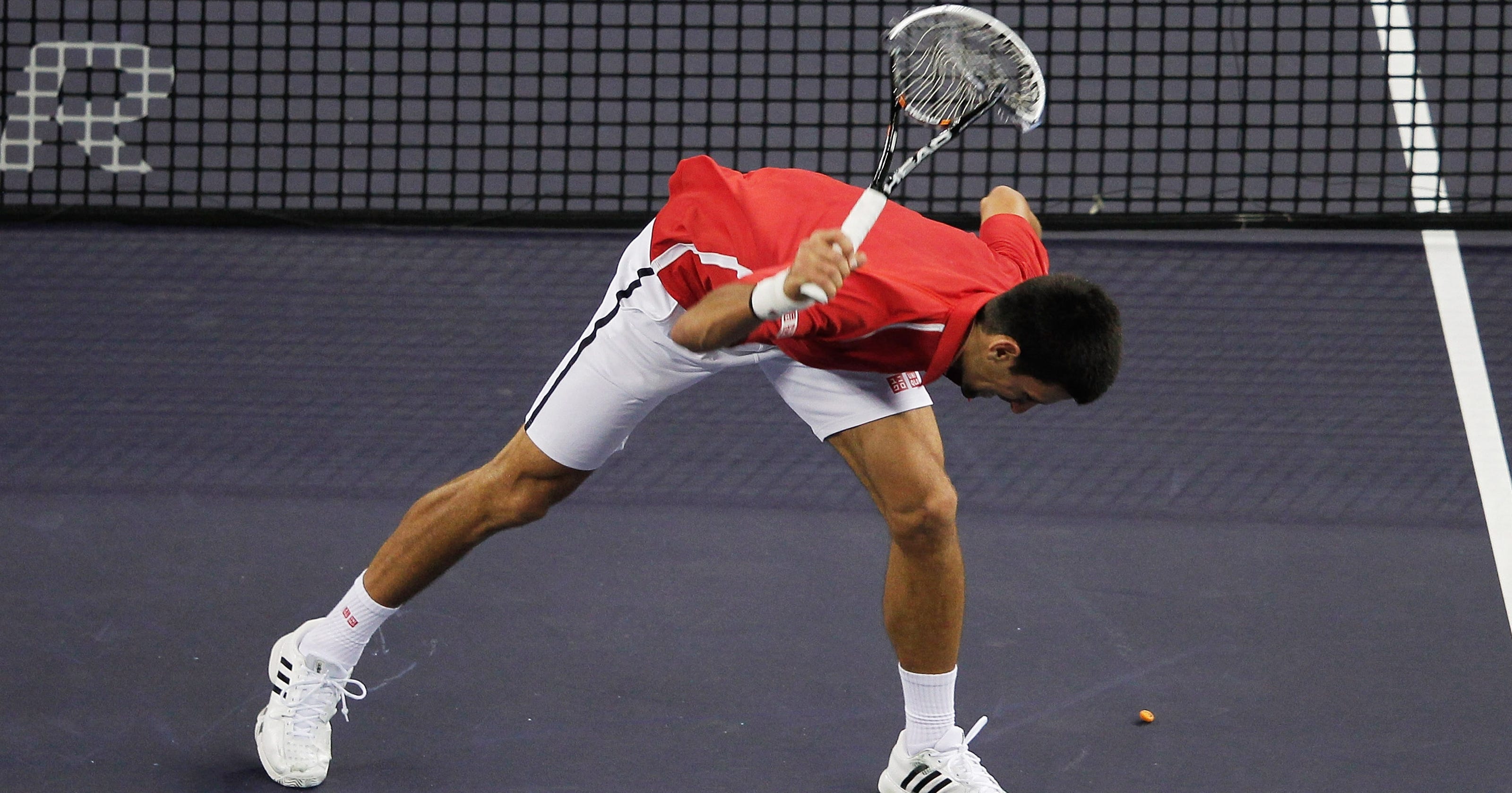 Novak Djokovic takes frustration out on his racket
