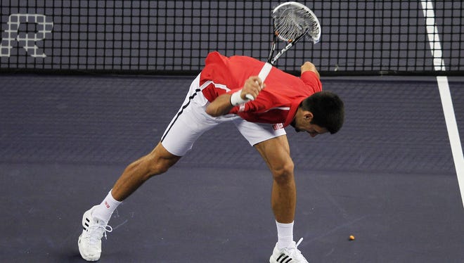 Novak Djokovic takes frustration out on his racket