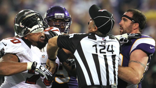 Vikings DE Jared Allen, right, and Bucs LT Donald Penn (70) had to be separated Thursday night.