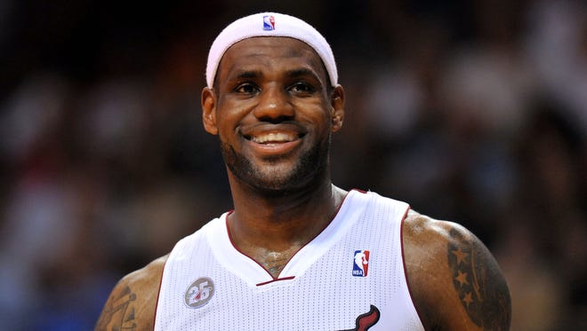 Heat forward LeBron James cracks a wide smile during Tuesday's win against the Timberwolves.