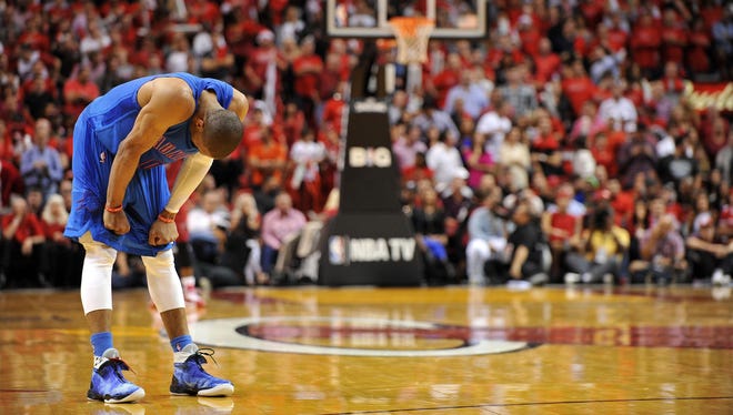 Thunder guard Russell Westbrook hangs his head late during Tuesday's 103-97 loss to the Heat.