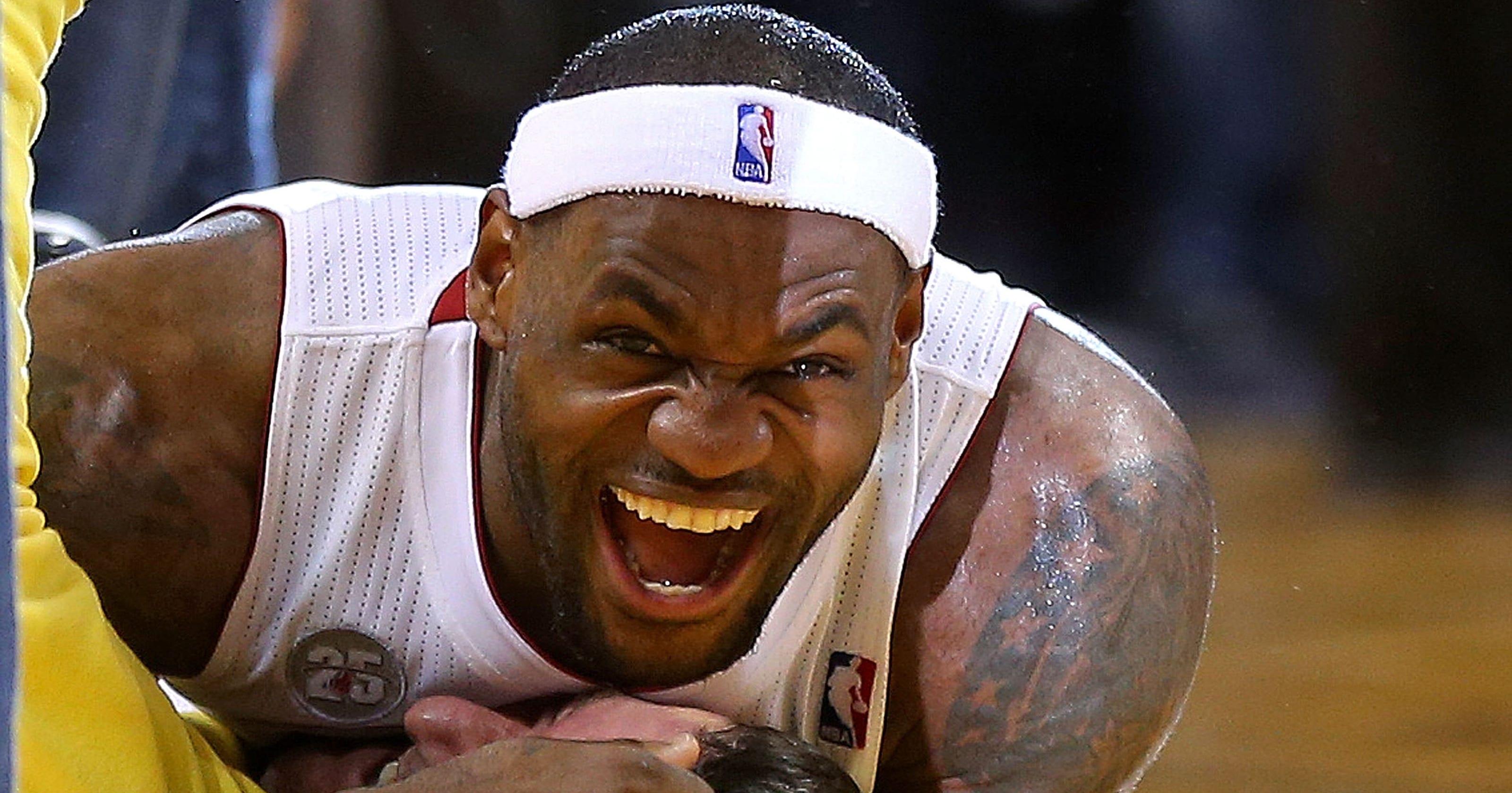 LeBron James tackles fan who hit halfcourt shot (VIDEO)