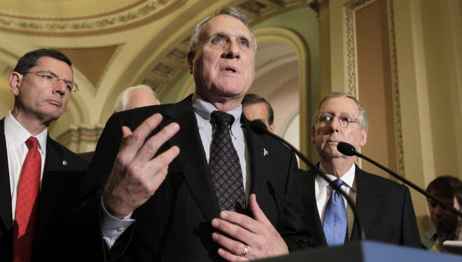 Jon Kyl, at the microphone, was the Senate's No. 2 GOP leader. He retired in January.