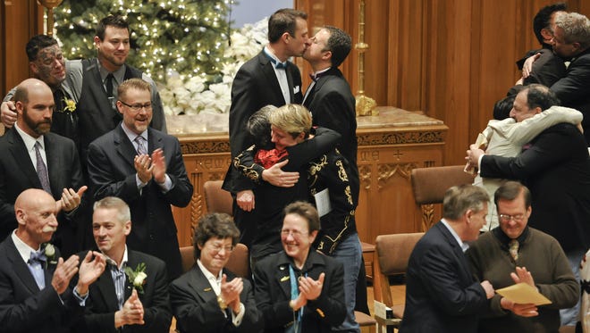 Same-sex couples in Seattle celebrate at their weddings.