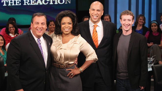 From left, New Jersey Gov. Chris Christie,  Oprah Winfrey, Newark Mayor Cory Booker and Facebook CEO Mark Zuckerberg on Oprah's show.