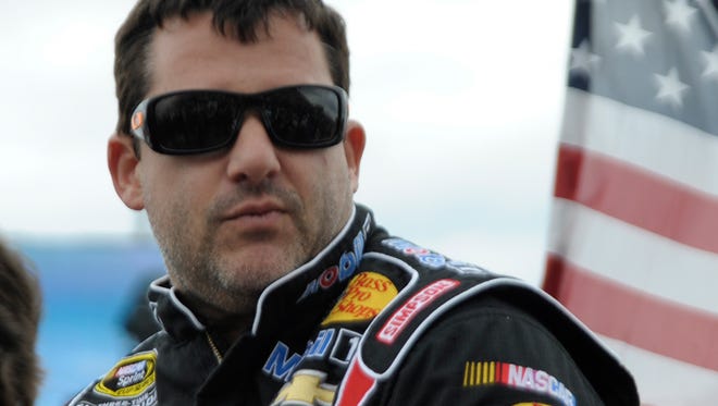 Sprint Cup Series driver Tony Stewart, shown during pre-race ceremonies at the Toyota/Save Mart 350, was involved in a 15-car wreck on a  half-mile oval dirt track in Canandaigua, N.Y.