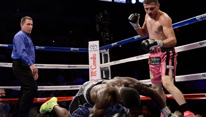 Andre Berto is knocked down by Jesus Soto Karass of Mexico, during their welterweight fight Saturday in San Antonio. Soto Karass won by TKO in the 12th round.