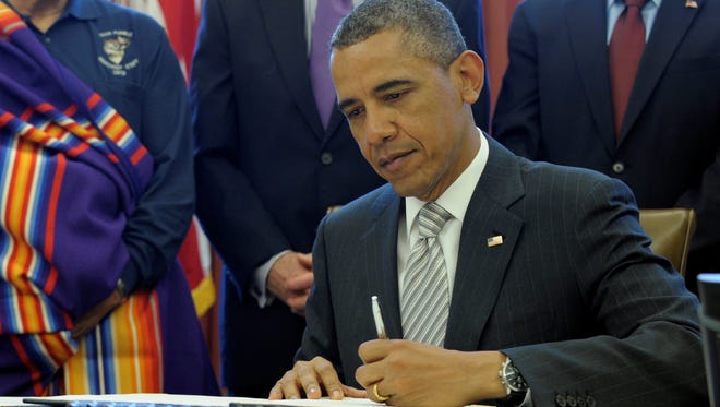 President Obama signing national monument legislation
