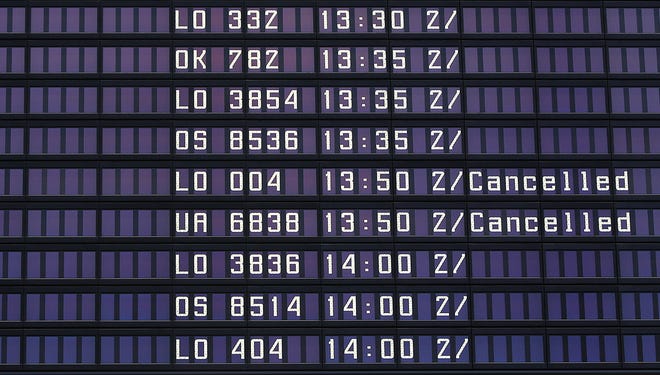 An information board at Warsaw's Chopin Airport shows LOT's cancelled Dreamliner flight from Chicago Jan. 17, 2013.