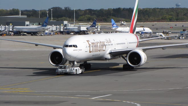 An Emirates airline Boeing 777 jet taxis toward the runway to take off from New York JFK (John F. Kennedy) International Airport on Oct. 18, 2012.