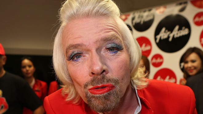 Virgin's Richard Branson loses bet, serves fliers in drag