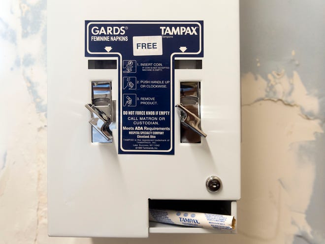A vending machine that dispenses Maxithin feminine napkins and Tampax tampons in a bathroom at the YWCA on Wednesday, July 11, 2018. The feminine products are provided freely to residents at the YWCA by Tranzonics, which has a factory in Karns that manufactures and distributes a variety of cleaning, maintenance and personal products.