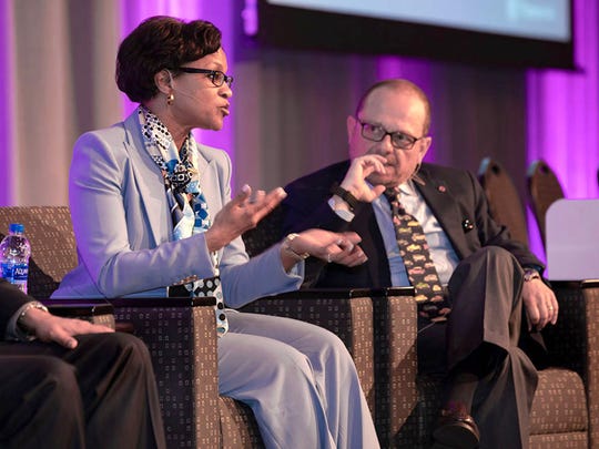 Denise Gray, president of LG Chem Michigan Inc. Tech Center and V. Anand Sankaran, director of electrified powertrain engineering at Ford, take part in a panel discussion at 2018 CTI Automotive Week USA in Novi on May 16, 2018.