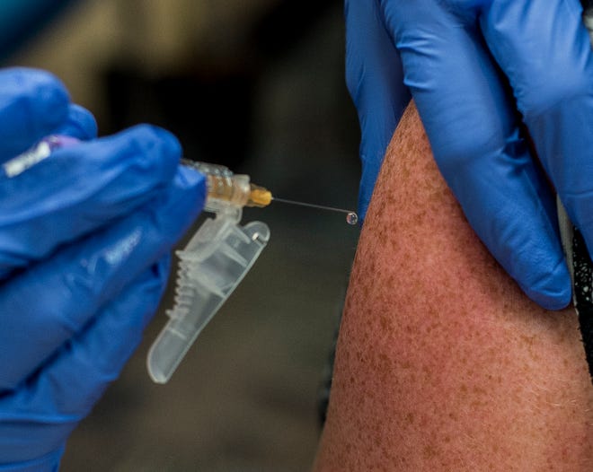 A Hepatitis A vaccine is administered during a clinic at the Wayne County Health Dept. on Thursday, July 19, 2018.