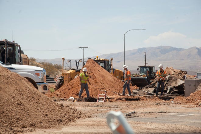 Construction crews continue work at the intersection of Bluff Street and Sunset Boulevard Wednesday, July 18, 2018.