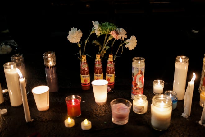 Candles are placed near the car of one of the victims from the duck boat crash as 300 community members gathered in the parking lot outside Ride the Ducks, lighting candles and placing flowers on the cars of two victims from the duck boat accident in Branson, Mo. on Friday, July 20, 2018. On Thursday, July 19, 2018, 17 people were killed when a duck boat, an amphibious vehicle, capsized on Table Rock Lake.