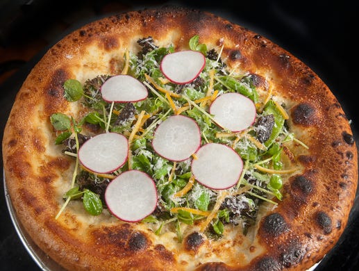 bar Vetti's Spring Veggie Pizza is topped with mascarpone cheese, kale, peas, radish, preserved Meyer lemon and pecorino cheese.
July 10, 2018