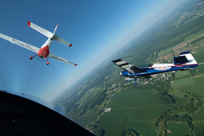 The Phillips 66 Aerostars practice aerobatics Tuesday, July 27, 2018, north of Oshkosh. The four-ship team uses Extra aircraft for its performances.