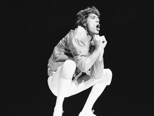 Mick Jagger performs during a concert by the Rolling Stones at the Hartford Civic Center in Hartford, Conn., Nov. 10, 1981. This was the first of two concerts scheduled in Hartford by the Stones. Both concerts were sold out within hours of their announcement. (AP Photo/Bob Child)