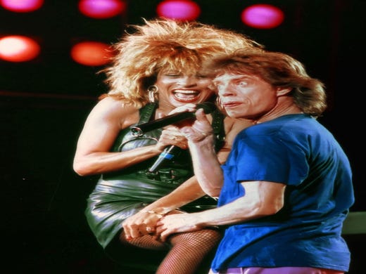 Tina Turner, left, reacts as Mick Jagger grabs her thigh during their duo performance at the Live Aid concert in Philadelphia, Pa., July 13, 1985. (AP Photo/Amy Sancetta) ORG XMIT: APHS199 [Via MerlinFTP Drop]